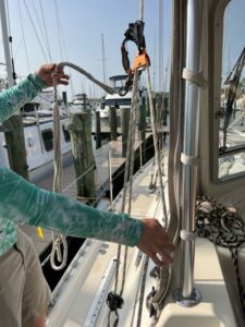 rigging for ascending/descending the mast which includes several lines, clips, and hooks