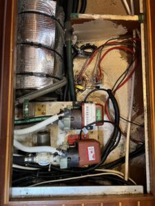 looking down on the area below the sole (cabin floor) where the 2 march pumps for the 2 AC units are.