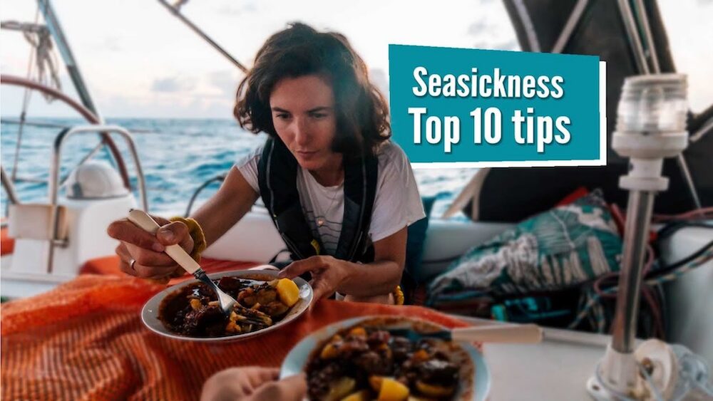 woman in a life jacket sitting in a cockpit hovers tentatively over a bowl of food. the label on the photo says "seasickness: top ten tips"
